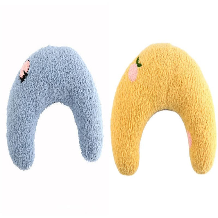 Two soft, plush toys shaped like elephants, one blue and one yellow, on a white background.
