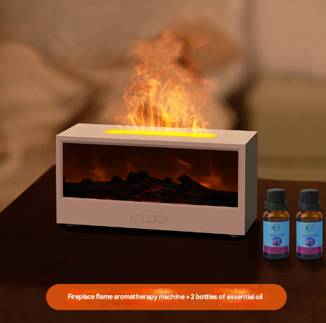 Fireplace flame aromatherapy machine with two bottles of essential oil on a wooden surface.