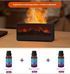 Fireplace flame aromatherapy machine with three bottles of essential oil on a wooden surface.