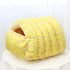 Yellow pet bed with a cute pattern on a white background