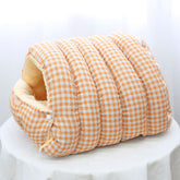 Orange and white checkered pet bed on a white background