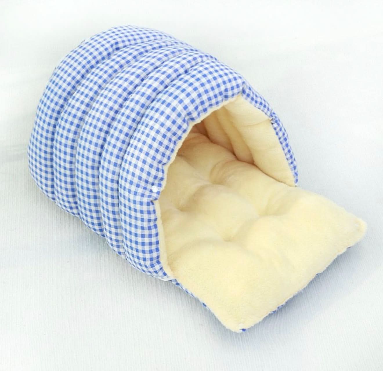 Blue and white checkered pet bed with beige interior on a white background