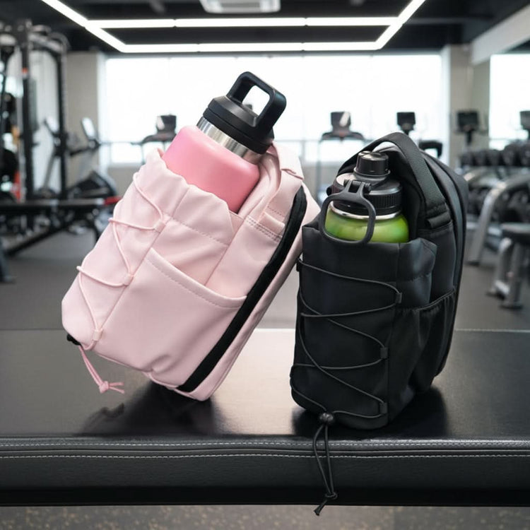 black and pink gym pouch bags sitting on a bench with gym picture background