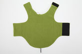 Green protective vest with black accents on a white background