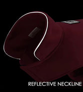 Maroon garment with reflective neckline on a black background
