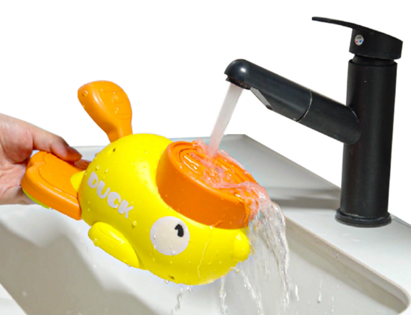 Yellow rubber duck being rinsed under a faucet in a sink