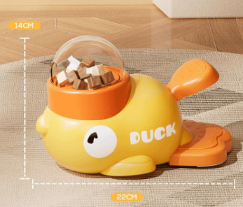Yellow duck-shaped container with a transparent lid on a wooden surface, showing measurements.