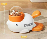 Duck-shaped pet toy with treats on a mat, showing measurements.