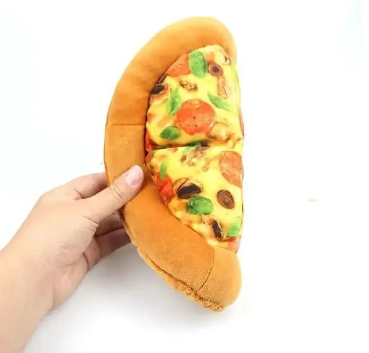 Hand holding a plush pizza slice chew toy for dogs, durable and bite-resistant design.