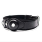 Black leather dog collar with GPS tracker holder and metal buckle, close-up view