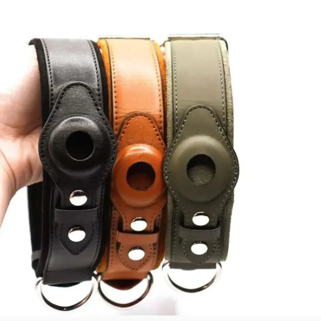 Three leather GPS dog collar holders in black, brown, and green with metal rings.