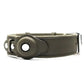 Brown leather dog collar with GPS tracker holder and metal buckle on white background