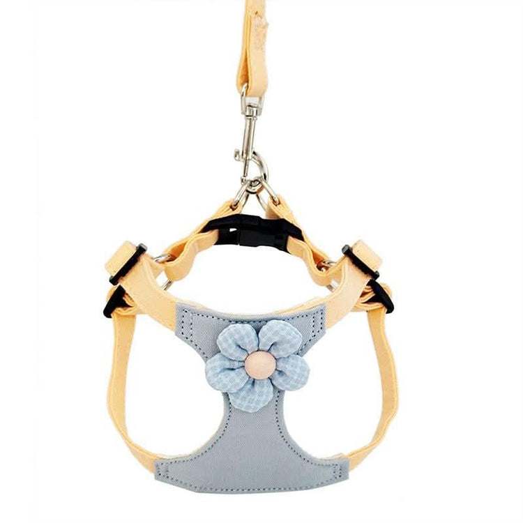 Small pet harness and leash set with pastel yellow straps and blue flower decoration
