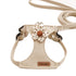 Beige dog harness and leash set with a polka dot flower accessory, adjustable straps