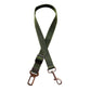 Adjustable green dog car seat belt with metal clip and buckle on white background