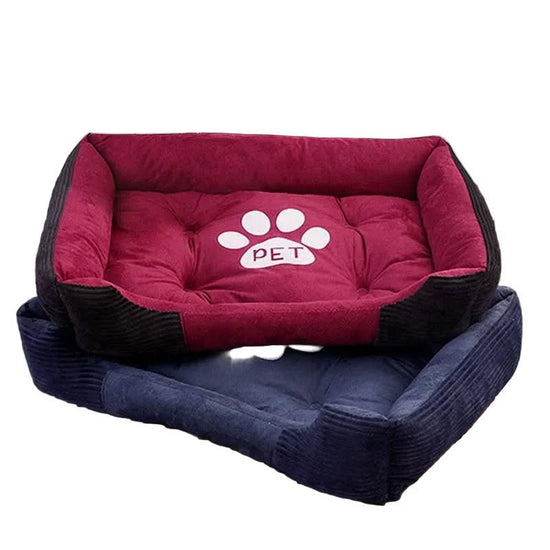 Stacked plush rectangular pet beds for dogs and cats in red and blue with paw print design.