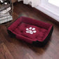 Plush rectangular winter pet bed for dogs and cats with a paw print design on a wooden floor