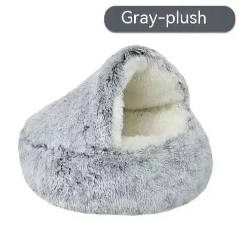 Gray plush semi-closed pet bed with soft, cozy, cave-like design for cats or small dogs.