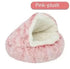 Semi-closed pink plush pet bed with soft, cozy interior for cats or small dogs