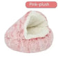 Semi-closed pink plush pet bed with soft, cozy interior for cats or small dogs